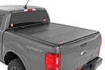 Rough Country Hard Tri-fold Flip Up Bed Cover 5' Ford Ranger 2-4WD 19-23. Fixed Price $849.95.