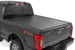 Rough Country 50517650 Hard Roll-up Tonneau Cover 17-26 Ford Super Duty 6.8'. Fixed Price $749.95.