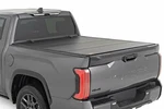 Rough Country Hard Tri-fold Flip Up Bed Cover 5'7" For Toyota Tundra 22-23. Fixed Price $849.95.