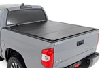 Rough Country Hard Flip Up Bed Cover For 07-21 Toyota Tundra 5'7' 49414551. Fixed Price $849.95.