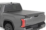 Rough Country Hard Tri-fold Flip Up Bed Cover 5'7" For Toyota Tundra 22-23. Fixed Price $849.95.